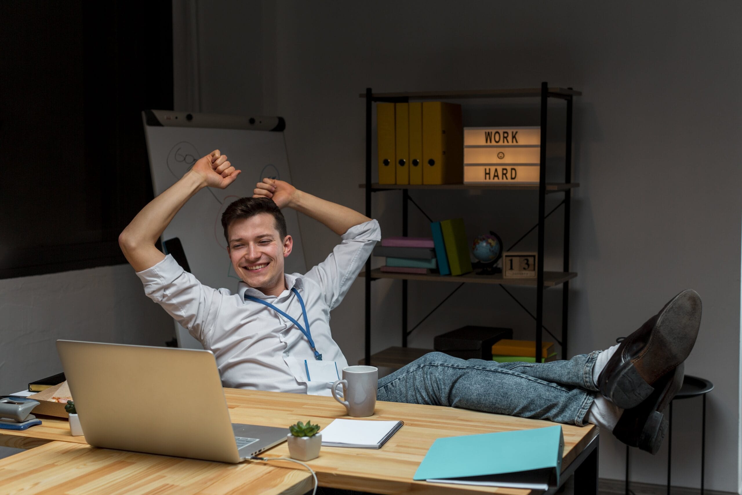 Young professional relaxing after completing remote tasks, symbolizing career success and work-life balance from learning AI prompt engineer courses in 2025.